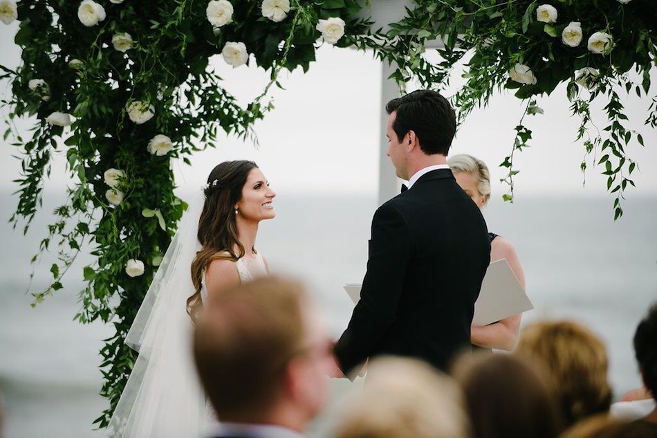 vows, bride, groom, ceremony, wedding, beach wedding, ocean side, flowers by cina, greenery