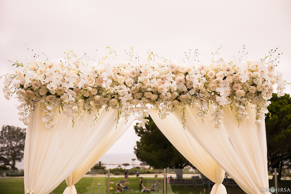 white flowers, flowers, wedding, arch, ceremony, enchanting laguna cliffs marriott