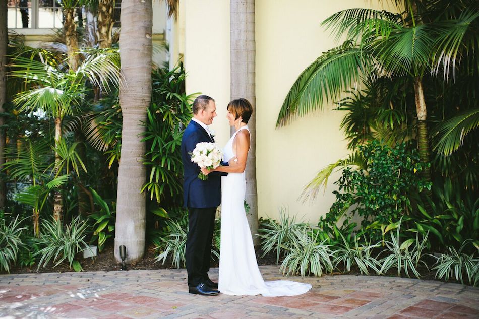 bride and groom, ritz carlton laguna niguel, flowers by cina, wedding flowers, wedding florist, orange county florist, ivory and gold