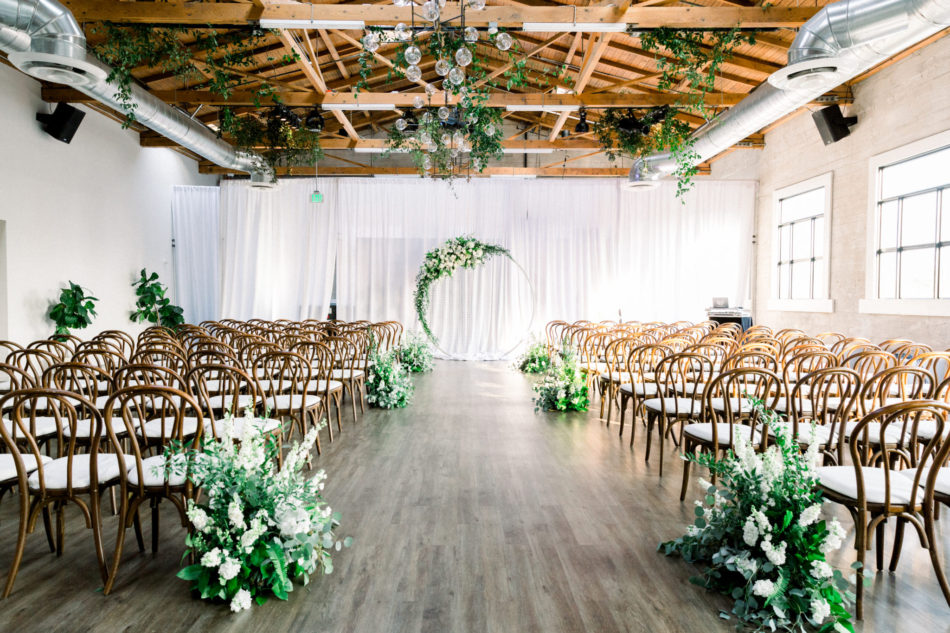 indoor ceremony, white wedding decor, floral-filled arch, floral design, florist, wedding florist, wedding flowers, orange county weddings, orange county wedding florist, orange county florist, orange county floral design, flowers by cina