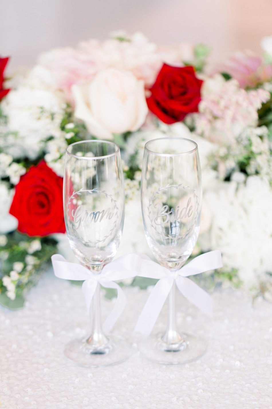 bride and groom, wedding toast, wedding champagne glass, floral design, florist, wedding florist, wedding flowers, orange county weddings, orange county wedding florist, orange county florist, orange county floral design, flowers by cina