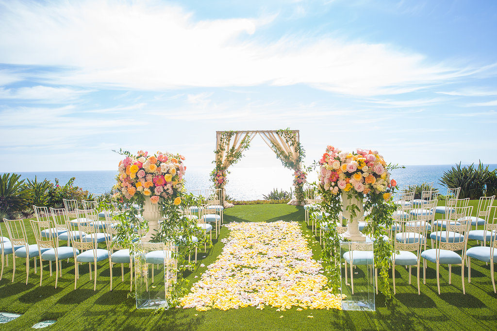 inside weddings feature, floral-filled ceremony, oceanfront floral ceremony, floral design, florist, wedding florist, wedding flowers, orange county weddings, orange county wedding florist, orange county florist, orange county floral design, flowers by cina