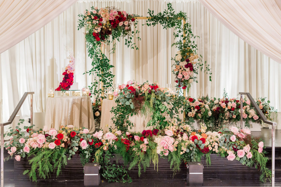 sweetheart table, vibrant florals, red and pink florals, floral design, florist, wedding florist, wedding flowers, orange county weddings, orange county wedding florist, orange county florist, orange county floral design, flowers by cina