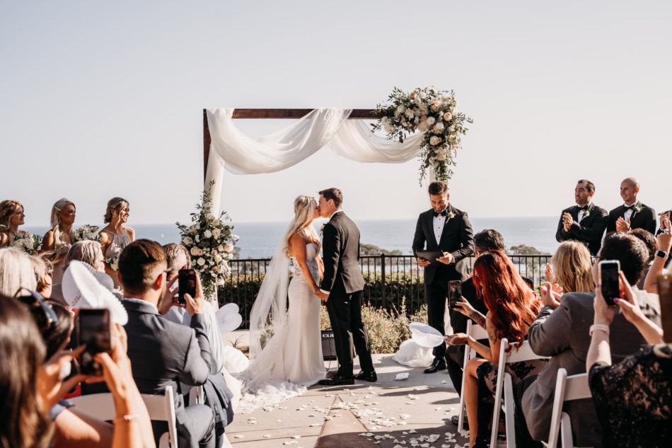 first kiss, bride and groom, oceanfront wedding, floral design, florist, wedding florist, wedding flowers, orange county weddings, orange county wedding florist, orange county florist, orange county floral design, flowers by cina