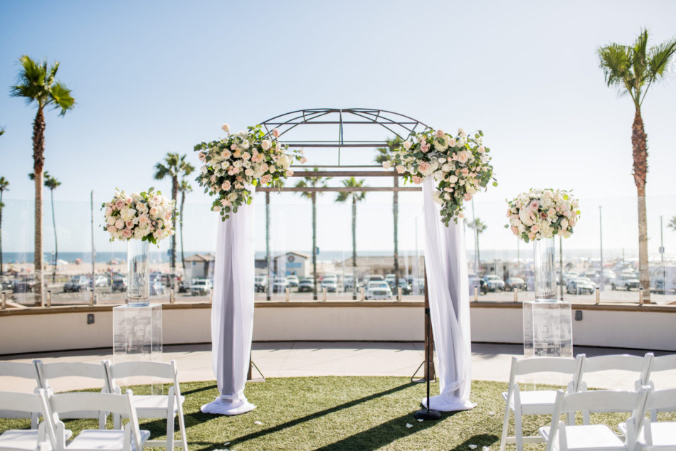 floral-filled arch, blush ceremony arch, blush beachfront wedding, floral design, florist, wedding florist, wedding flowers, orange county weddings, orange county wedding florist, orange county florist, orange county floral design, flowers by cina