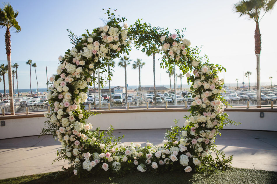 classic blue hued wedding, floral-filled arch, blush ceremony blooms, beautiful coastal wedding, floral design, florist, wedding florist, wedding flowers, orange county weddings, orange county wedding florist, orange county florist, orange county floral design, flowers by cina