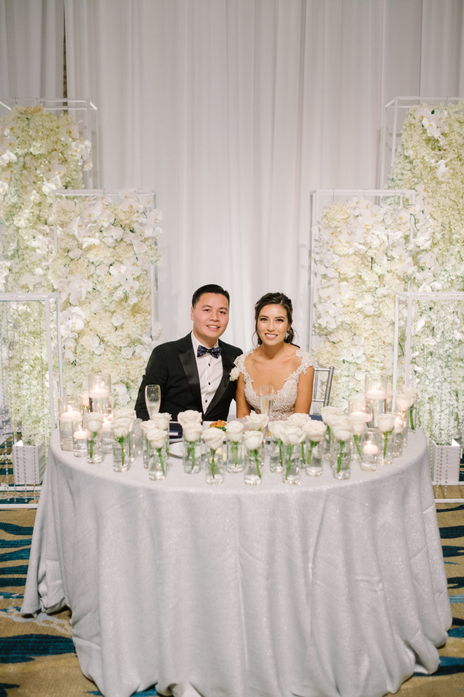 sweetheart table, bride and groom, sweetheart table florals, magnificent all-white wedding, floral design, florist, wedding florist, wedding flowers, orange county weddings, orange county wedding florist, orange county florist, orange county floral design, flowers by cina