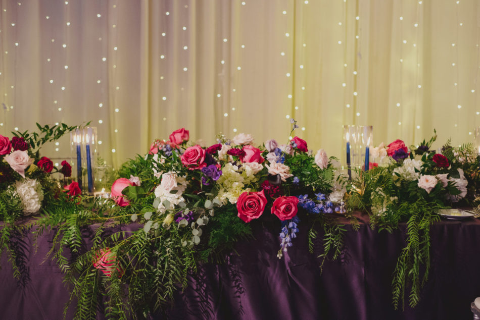 sweetheart table, colorful reception blooms, vibrant oceanfront wedding, floral design, florist, wedding florist, wedding flowers, orange county weddings, orange county wedding florist, orange county florist, orange county floral design, flowers by cina