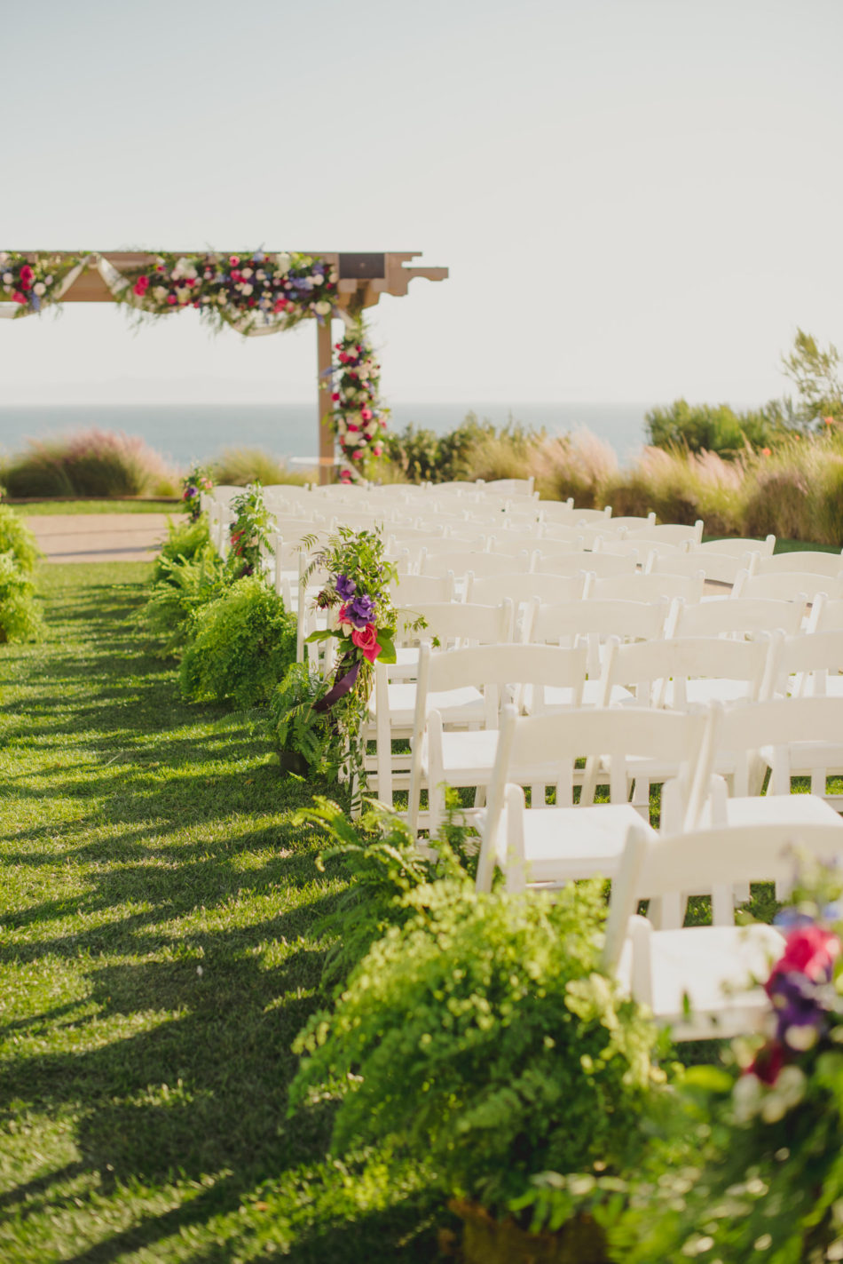 purple ceremony florals, colorful ceremony setup, vibrant oceanfront wedding, floral design, florist, wedding florist, wedding flowers, orange county weddings, orange county wedding florist, orange county florist, orange county floral design, flowers by cina