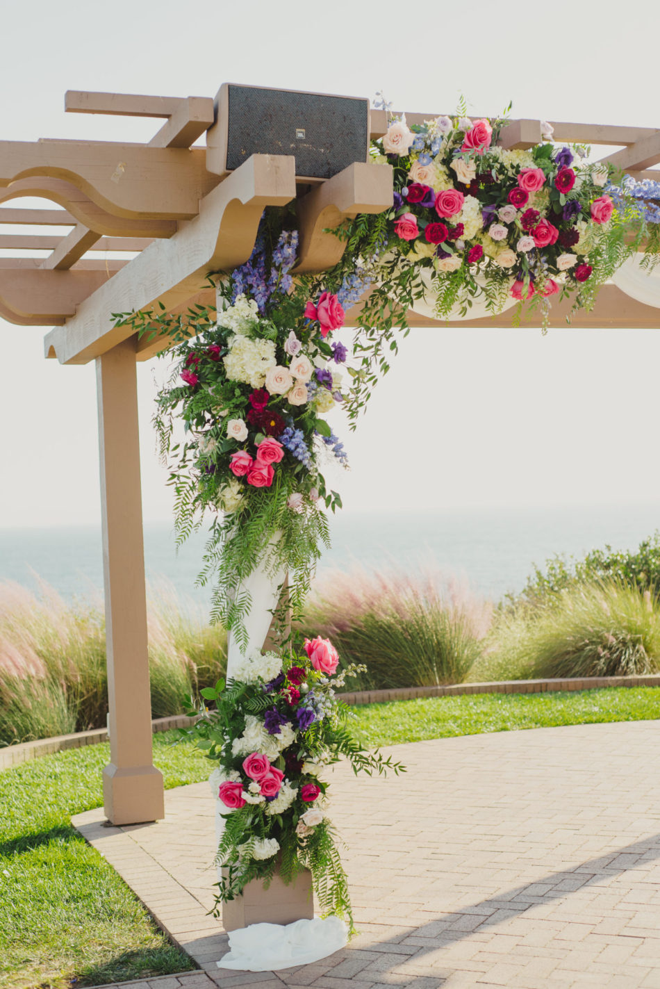 colorful ceremony arch, colorful ceremony florals, vibrant oceanfront wedding, floral design, florist, wedding florist, wedding flowers, orange county weddings, orange county wedding florist, orange county florist, orange county floral design, flowers by cina