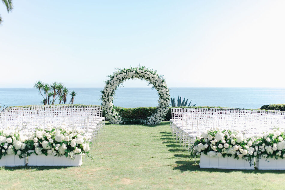 all-white ceremony, white ceremony florals, circular arch, gorgeous oceanfront wedding, floral design, florist, wedding florist, wedding flowers, orange county weddings, orange county wedding florist, orange county florist, orange county floral design, flowers by cina
