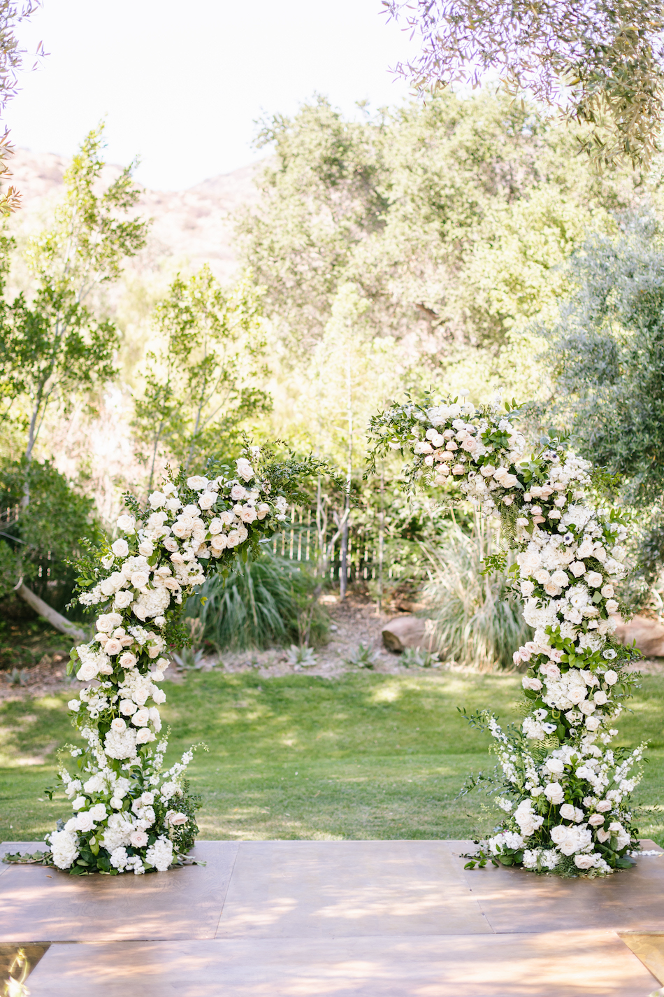 white ceremony arch, floral arch, ceremony arch, floral design, florist, wedding florist, wedding flowers, orange county weddings, orange county wedding florist, orange county florist, orange county floral design, flowers by cina