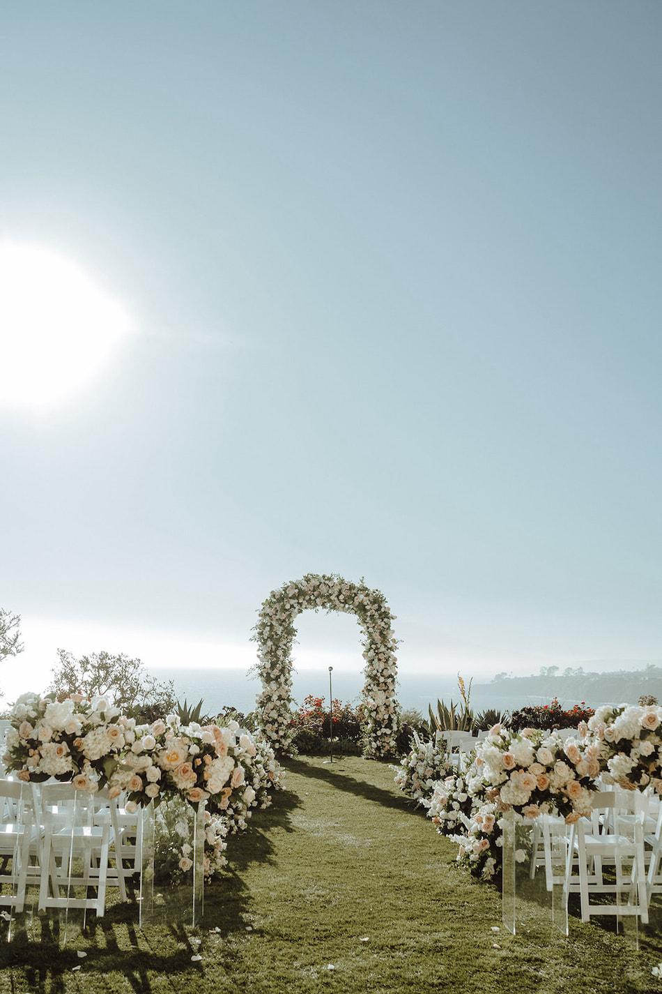 floral design, florist, wedding florist, wedding flowers, orange county weddings, orange county wedding florist, orange county florist, orange county floral design, flowers by cina, oceanfront ceremony, floral arch, blush ceremony blooms